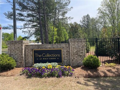 Stately monument sign with seasonal flowers! Such 