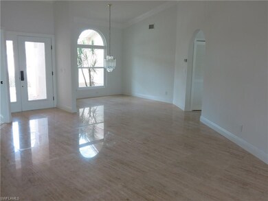 Formal dining room with marble flooring and crown 