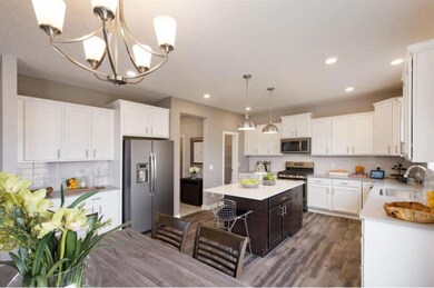 Lovely kitchen cabinetry with soft close doors and drawers, solid surface countertops, and new slate appliances! Finishes will vary.