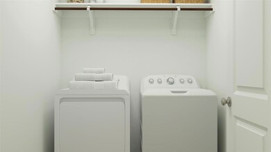Clothes washing area featuring washing machine and dryer