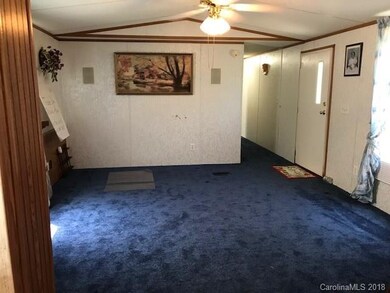 Living room has built in cabinet