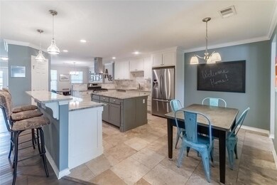 Wow! The kitchen with separate breakfast bar and b