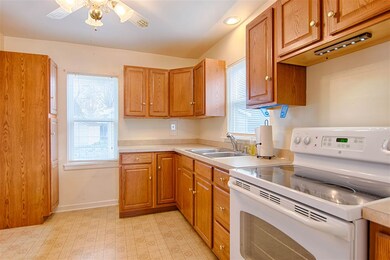 The kitchen offers convenient access to the living