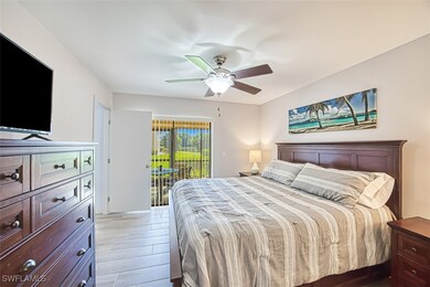 Bedroom featuring ceiling fan and access to exteri