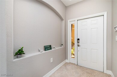 Entrance foyer featuring light tile patterned floo