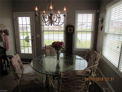 The spacious kitchen offers a dining area that lea