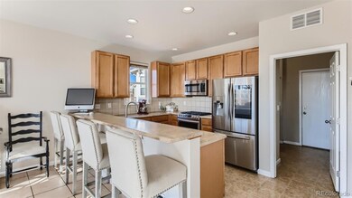 Big, open kitchen with counter seating for 4