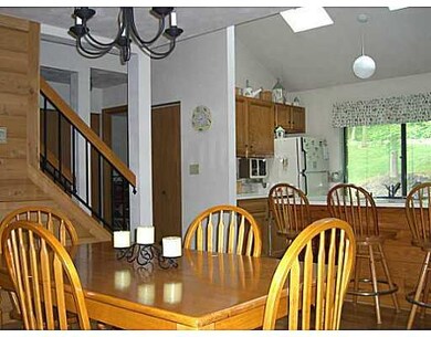 Dining Room. Looking into kitchen and back hall to