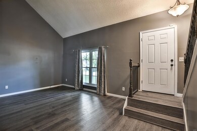 6 panel front door opens into the Living Room that
