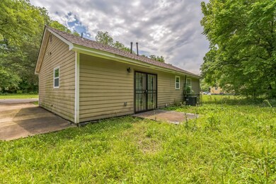 Rear view of property with central AC unit, a patio, and french doors