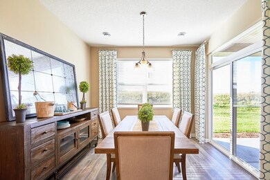 This dining space feels like a sunroom! Imagine en