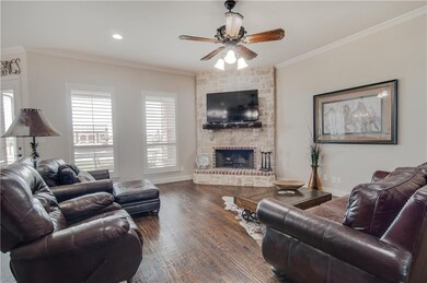 Family Room with hand scraped wood floors and ston