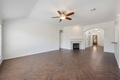 This spacious living area features elegant herring