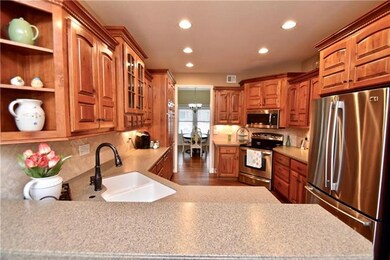 Beautiful Cherry Cabinetry & Solid Surface Counter