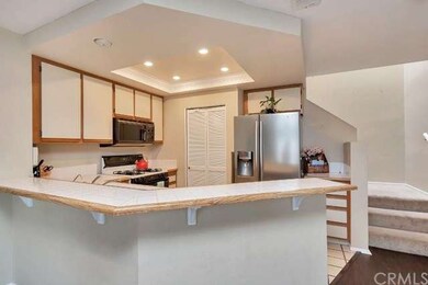 Updated kitchen with raised ceiling that has reces