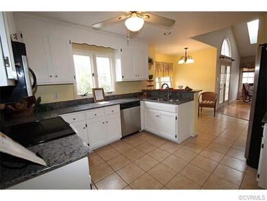 Modern eat-in kitchen, granite countertops, stainl