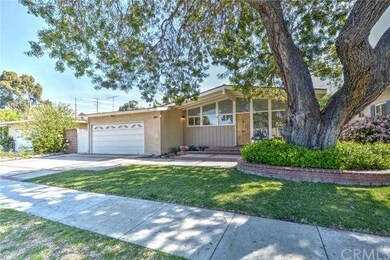 Lovely curb appeal and a large shade tree that kee