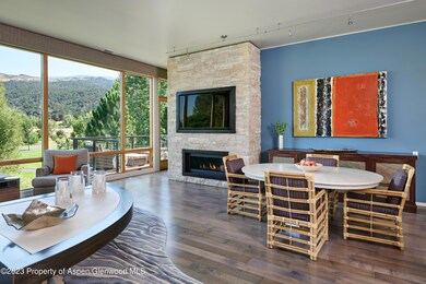 Dining area with custom stone fireplace