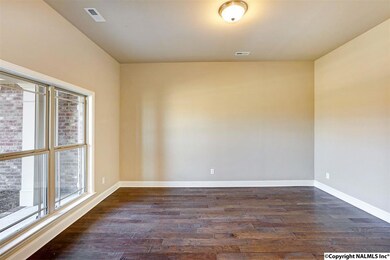 Now this is a study! Plenty of space or furniture - it could be used for so many other things.  Formal living, play room, etc.