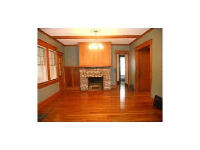 Living Room. Gleaming wood floors and fireplace, n