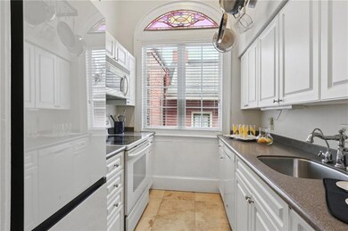 The galley kitchen is spacious and offers plenty of storage and counterspace for its smaller footprint!