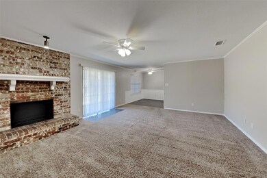 Unfurnished living room featuring crown molding, c