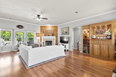 Custom oak built-ins and fireplace wall warm up th