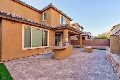 View of patio featuring fence and visible vents