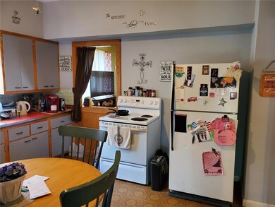 Kitchen includes stove and refrigerator.