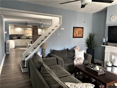 Experience the charm from the open staircase betwe