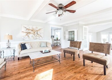 Bright and spacious! Opening to the eat in area of the kitchen and family room.