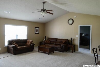 New Carpet! Large open floor plan with vaulted ceiling, ceiling fan, lots of natural light.