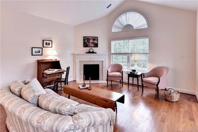 Large great room with vaulted ceiling and gleaming