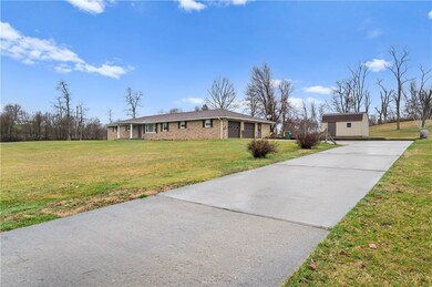 The home offers a large driveway and custom built
