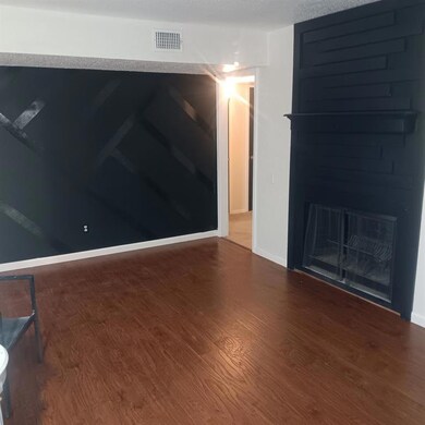 Spare room featuring wood-type flooring