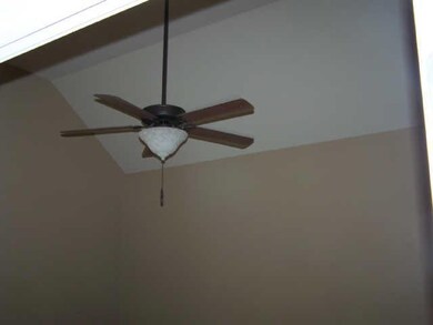Vaulted Ceiling in MBR with ceiling fan.