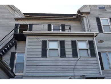 Exterior Back. Fire escape with 2...