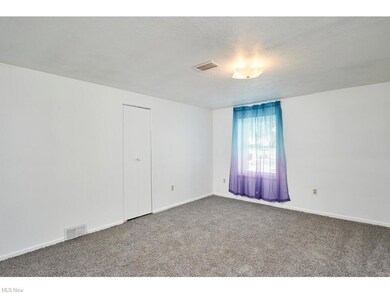 Master Bedroom with new carpet and window treatmen