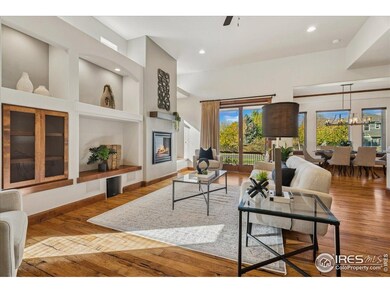Living room with built-in cabinets and art niches.