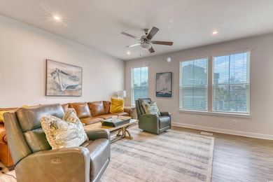 Living area with ceiling fan, recessed lighting, w