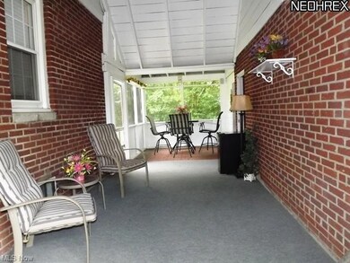 Charming enclosed porch and breezeway.