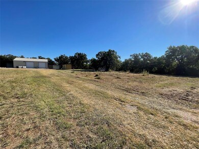View of yard with a rural view