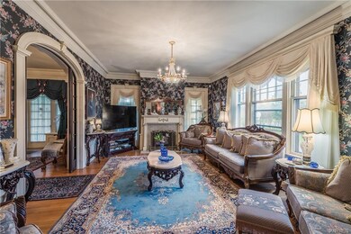 Formal sitting room/family room with fireplace and