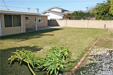 Pool-Sized Backyard with Covered Patio & Lush Lawn