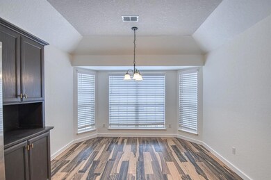 Unfurnished dining area with baseboards, visible v