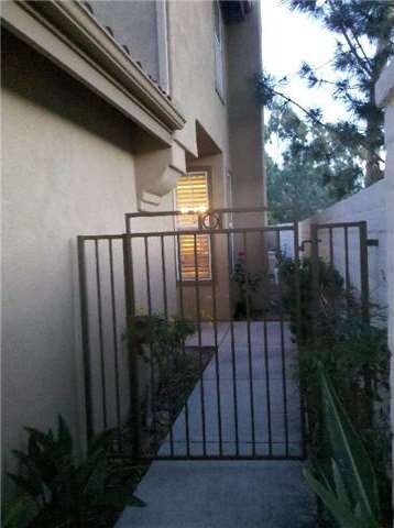 Gated entry to front door and private patio yard
