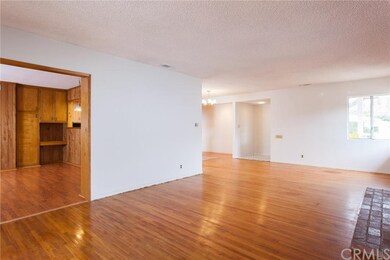 view of living room towards front door, from slidi
