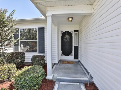 Welcoming front door with screen and side light