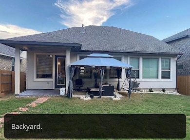 Back of house with a gazebo, a patio area, and a 