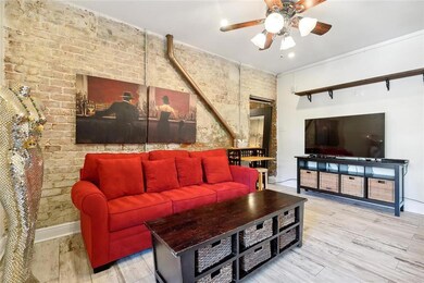 Exposed brick featured in stylish livingroom